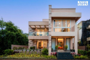 StayVista's Rosso with Outdoor Pool, Theatre-Disc Room & Games Room